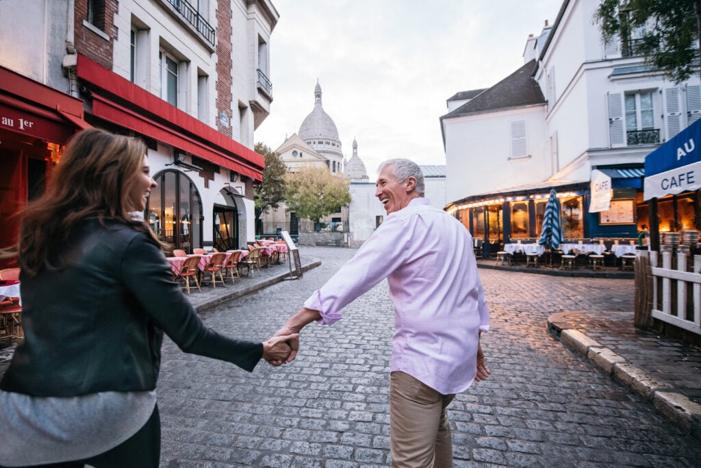 a couple holding hands on an Adventures By Disney trip
