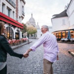 a couple holding hands on an Adventures By Disney trip